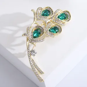 Macro view of emerald green calla lily brooch with sparkling crystal rhinestones