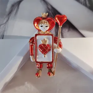 Vintage red heart soldier brooch with gold crown, enamel finish and heart scepter detail.