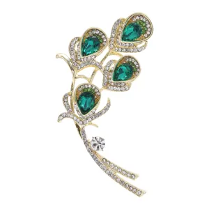 Vintage gold brooch with emerald green teardrop crystals and sparkling clear rhinestones