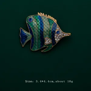 Detailed view of colorful enamel tropical fish brooch with sparkling rhinestones