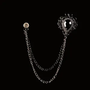 Elegante spilla vintage a catena argento con pietra nera a goccia e dettagli in cristallo