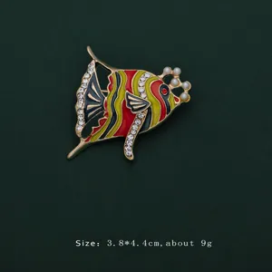 Detailed view of colorful enamel tropical fish brooch with rhinestones and pearls