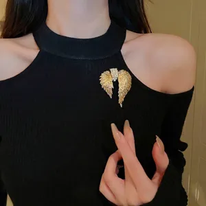Luxury angel wings brooch with sparkling rhinestones on elegant black knit wear