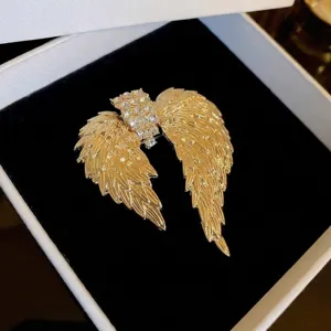Elegant gold-toned angel wing brooch pin featuring sparkling crystal rhinestone embellishments.