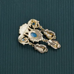 Detailed macro view showing back structure of vintage baroque style gold brooch