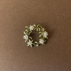 Exquisite vintage Baroque style brooch with green enamel leaves and white pearl flowers