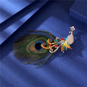 Macro detail of elegant peacock brooch featuring vibrant enamel and real feather