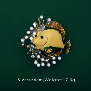 Macro detail of vibrant yellow tropical fish brooch with pearls, crystals, size 4x4cm