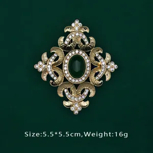 Baroque gold brooch with emerald green stone and clear rhinestones, size 5.5x5.5cm