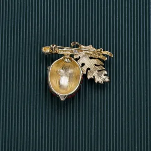 Detailed back view of a vintage Baroque style gold brooch with secure pin fastener.