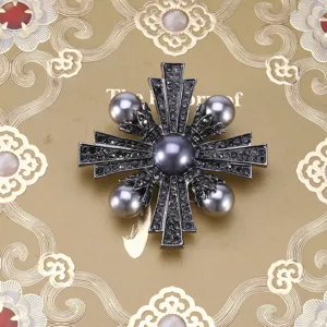 Vintage Baroque cross brooch featuring elegant grey pearls and sparkling black rhinestones detail