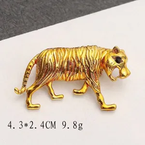 Detailed macro view of a vintage gold-plated tiger brooch with precise measurements