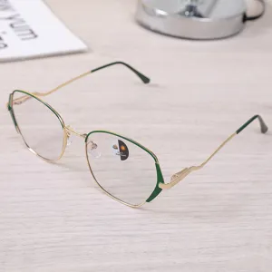 Detailed view of gold and green metal frame glasses with 2-in-1 photochromic lenses