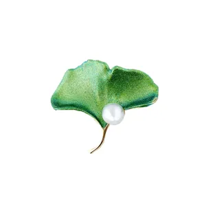 Elegant green ginkgo leaf brooch featuring a white pearl accent for women's jewelry