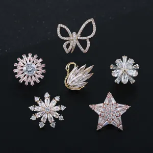 Elegante juego de broches de cisne y mariposa con circonitas microincrustadas.