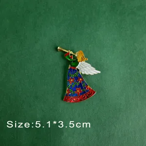 Detailed macro view of a colorful vintage enamel angel brooch playing a gold trumpet