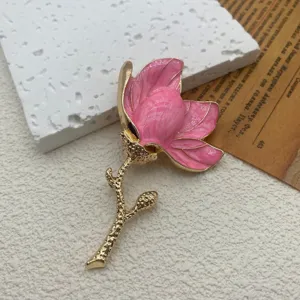 Exquisite close-up detail of vintage pink enamel tulip flower brooch with gold finish