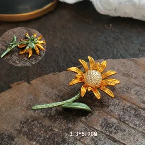 Detail view of vintage enamel sunflower brooch with green stem and 3.3x5.9cm size