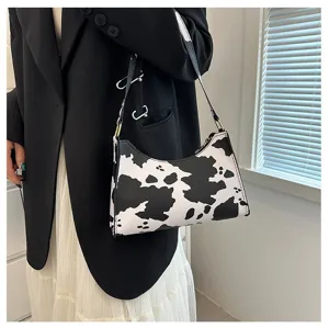 Chic cow print baguette shoulder bag with black and white pattern for women