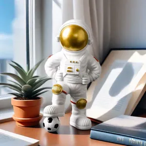 Detailed close-up of astronaut figurine stepping on a soccer ball decoration.