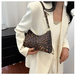Elegant leopard print underarm baguette bag styled with a professional white blazer.