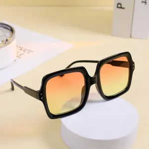 Fashionable oversized square sunglasses for women with orange gradient lenses