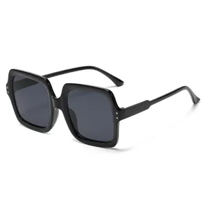 Classic women's oversized square sunglasses with shiny black frames and grey lenses