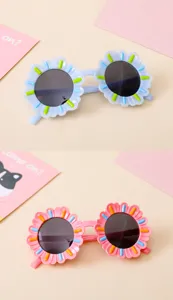 Cute sunflower shaped cartoon sunglasses for kids available in blue and pink pastel colors