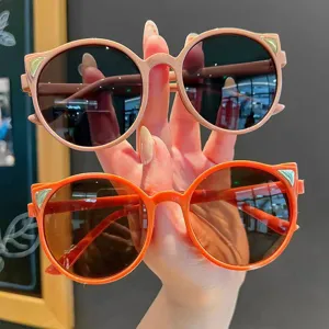 Trendy UV400 round cat-ear sunglasses for little girls in orange and pink frames