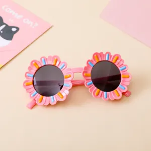 Pink sunflower shaped kids sunglasses with colorful decorative bars and UV protection