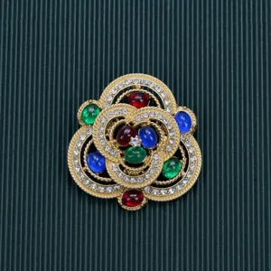 Vintage baroque palace style gold brooch with colorful gemstones and rhinestones