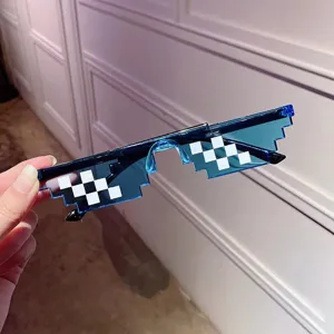 Detail view of blue pixelated mosaic sunglasses for party and photography props.