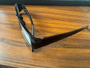 Detailed view of fashionable black square frame reading glasses with +2.50 power label