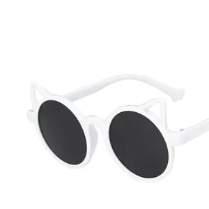 Side view of stylish white children's sunglasses with cute cat-ear shaped frames.