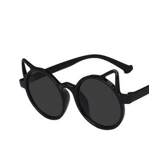 Close-up of children's black sunglasses with cute cat ear frame design