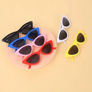 Collection of vintage cat-eye sunglasses in black, blue, pink, red, white, and yellow