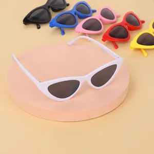 Detailed view of retro cat-eye sunglasses in multiple vibrant colors for women