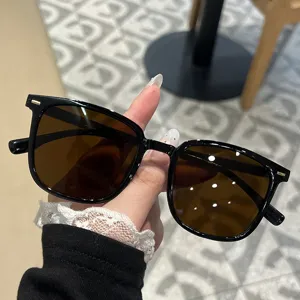 Stylish square frame sunglasses with black frames and brown lenses for face slimming