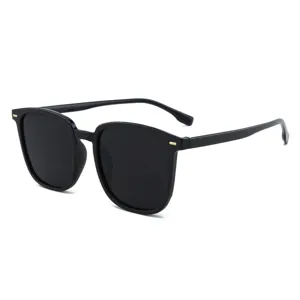 Modern oversized square frame sunglasses for women and men with black lenses and gold accents