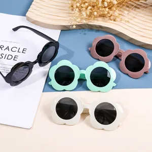 Cute flower-shaped children's sunglasses for ages 1-8 in assorted pastel colors