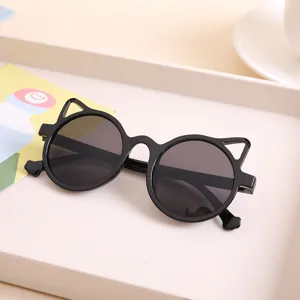 Stylish cat ear children's sunglasses with black round frames and protective dark lenses