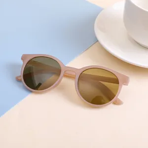 Stylish round frame sunglasses for kids in candy pink, trendy children's eyewear