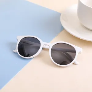 Trendy children's round frame sunglasses in white for parties and outdoor activities.