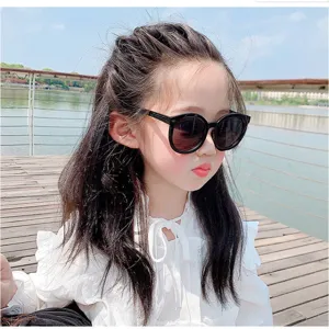 Trendy black round frame sunglasses for kids featuring cute fashion design for outdoor play