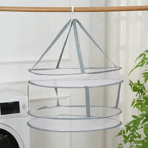Professional foldable 2-layer mesh laundry drying rack hanging next to a washing machine.