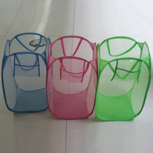 Detail view of blue, pink, and green foldable mesh laundry baskets for home storage