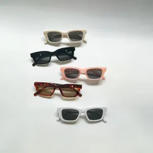 Set of 5 retro rectangular sunglasses for children in various colors on white background