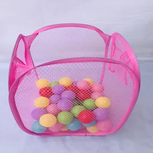 Close-up view of a pink foldable mesh storage basket filled with colorful plastic toy balls