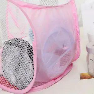 Detail view of a pink foldable mesh laundry basket showing breathable fabric texture