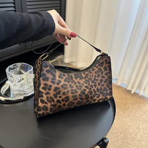 Stylish leopard print underarm bag for women with vintage hobo design.